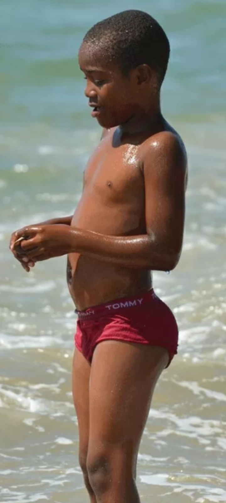 Black boy enjoying the beach